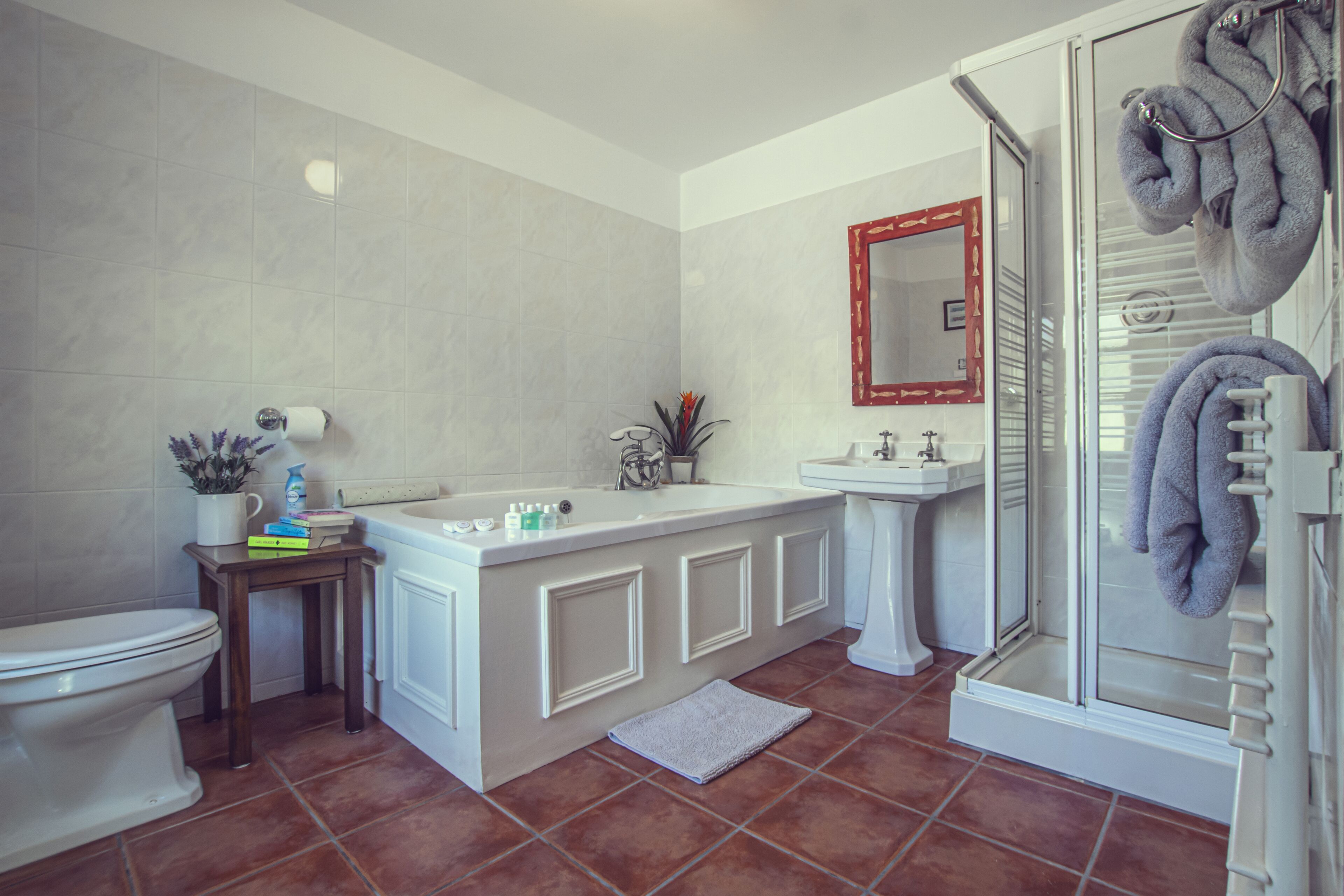 designer toiletries, hair dryer, bathrobes, slippers