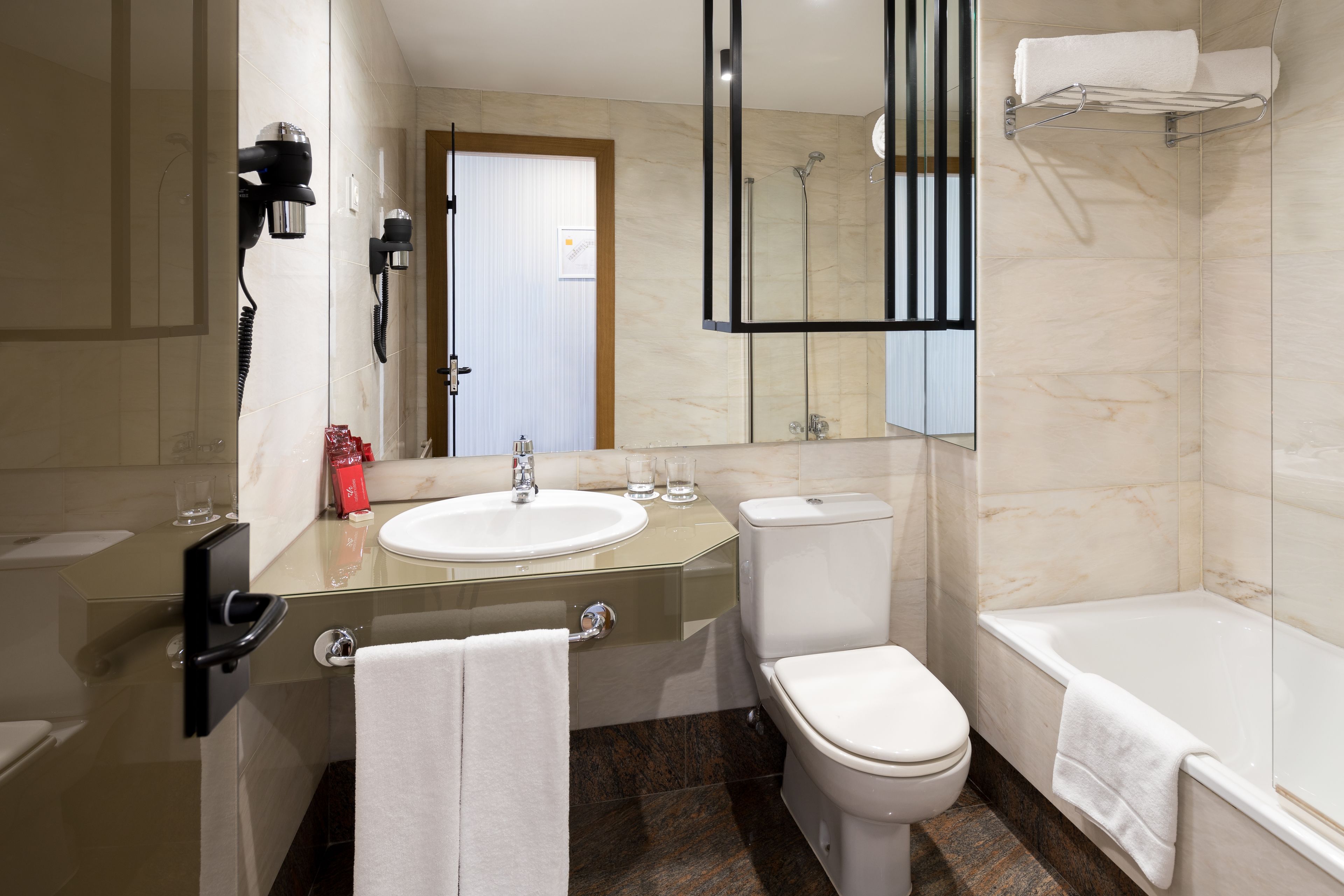 family room | bathroom | combined shower/bathtub, deep-soaking bathtub, designer toiletries