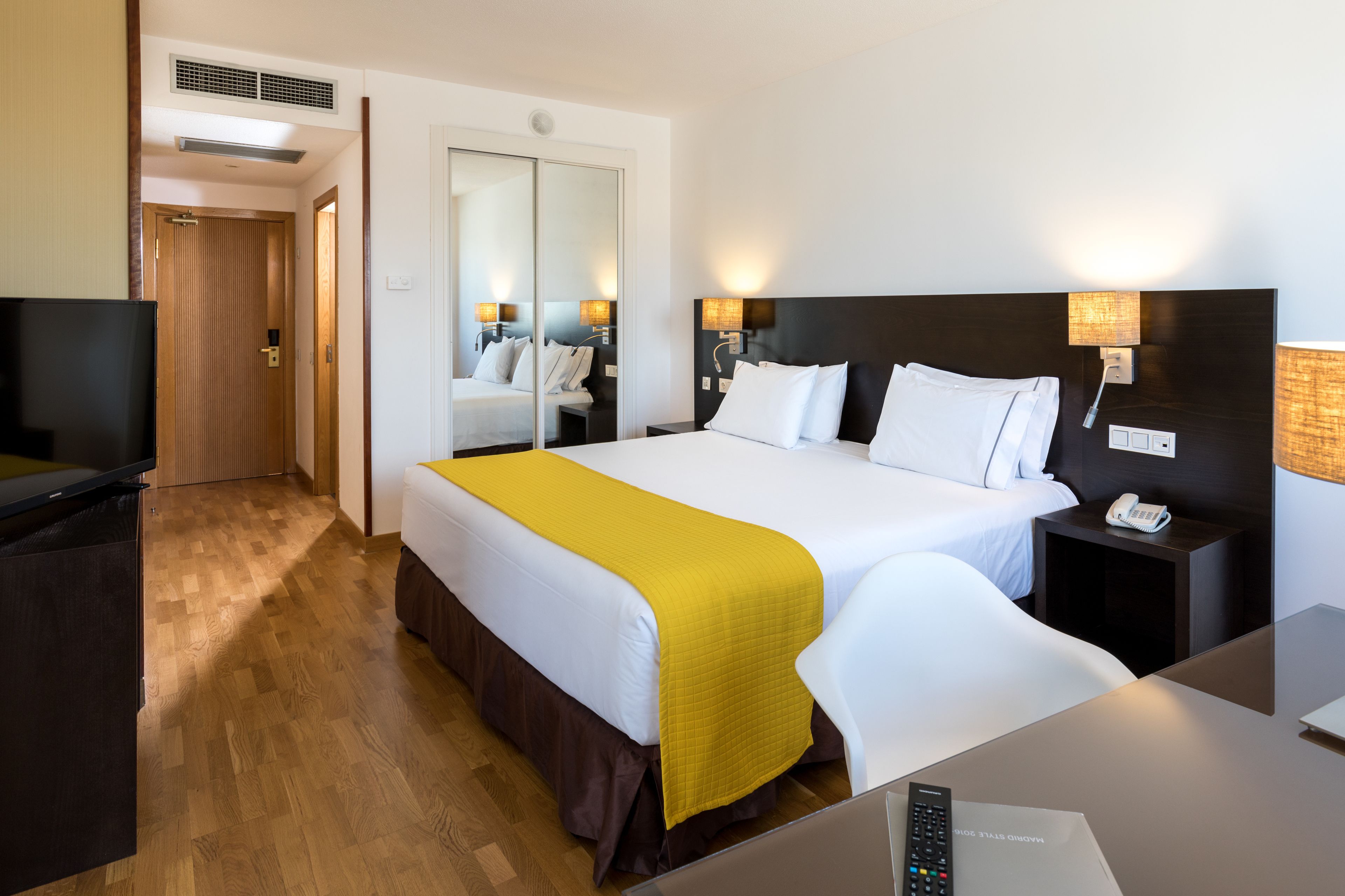 family room | 1 bedroom, minibar, in-room safe, desk