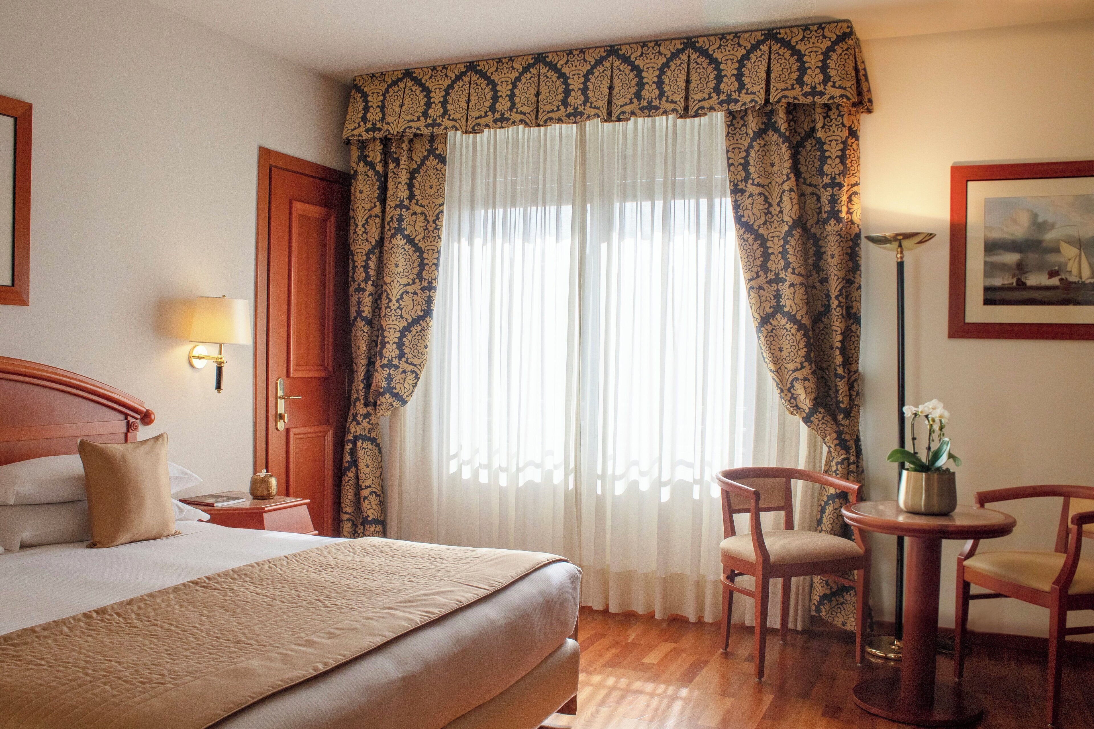 superior room | in-room safe, desk, blackout curtains, soundproofing