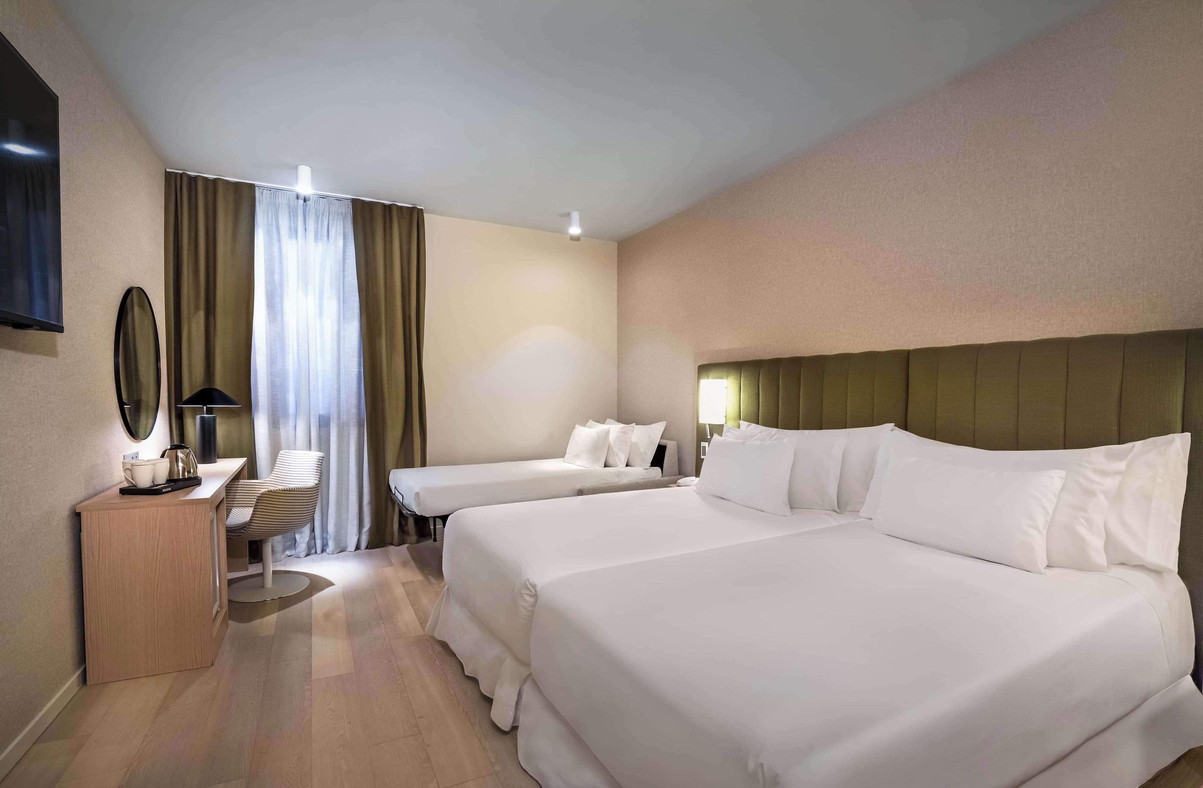 family room | premium bedding, down duvets, minibar, in-room safe