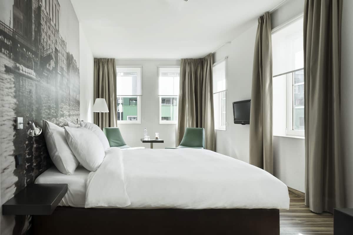 factory design room | down duvets, in-room safe, desk, blackout curtains