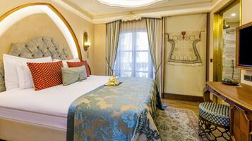 A well-appointed hotel room with a large bed, a desk, and a television.