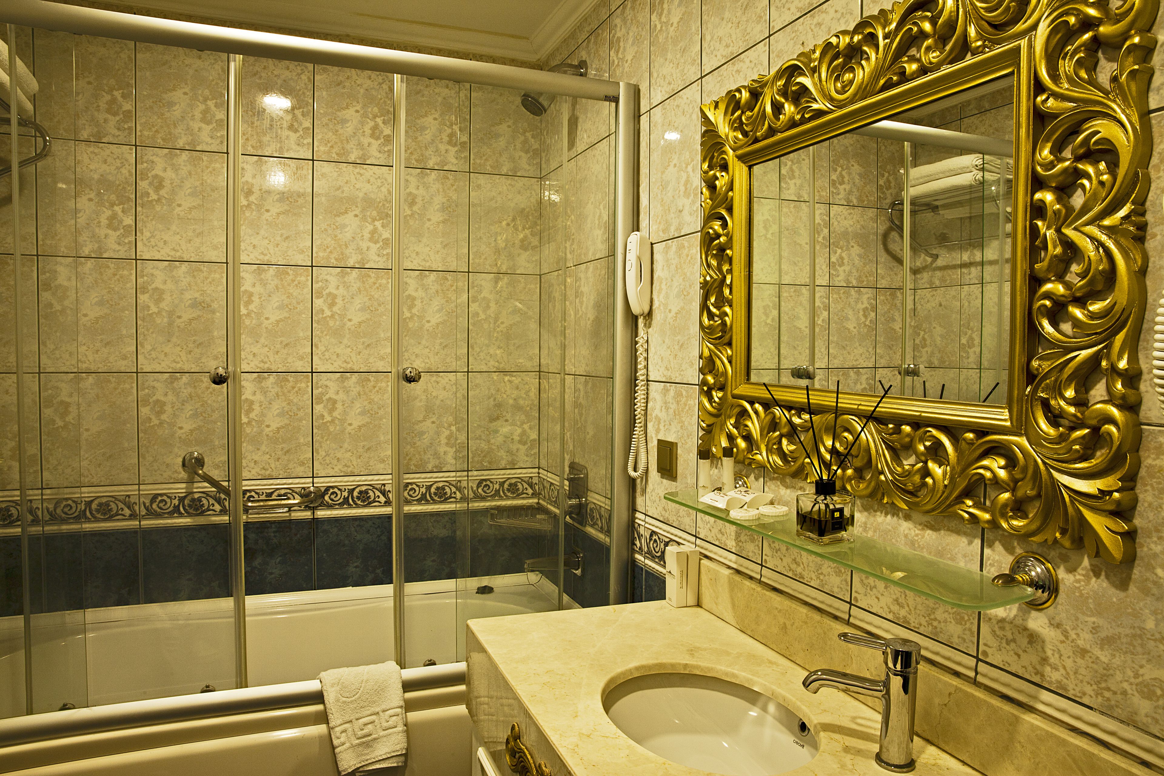 luxury suite | bathroom | shower, free toiletries, hair dryer, slippers