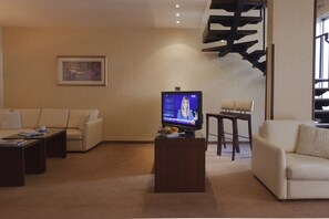 Executive Suite, 1 Bedroom | Living area | LCD TV