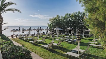 Sun loungers, beach umbrellas, beach towels, beach bar
