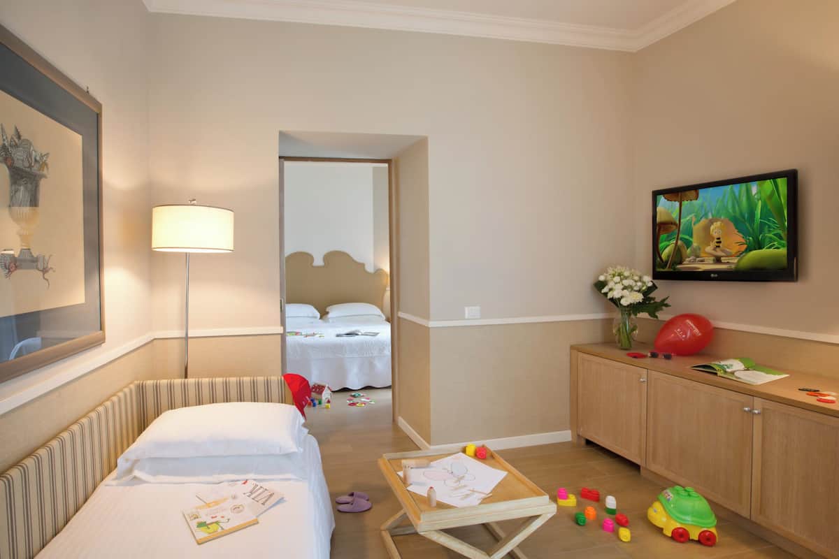 Family Room | 1 bedroom, premium bedding, minibar, in-room safe