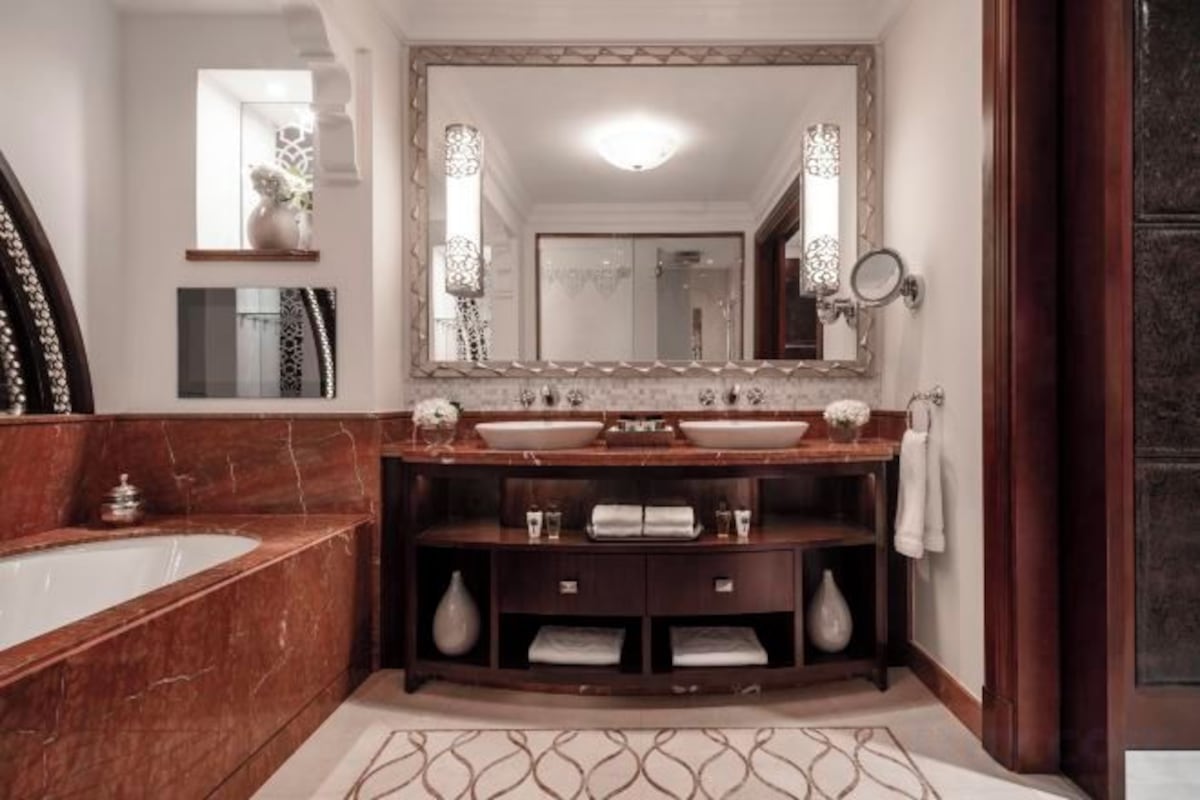 Separate bathtub and shower, deep-soaking bathtub, designer toiletries