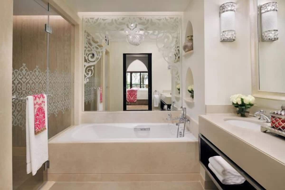 Separate bathtub and shower, deep-soaking bathtub, designer toiletries