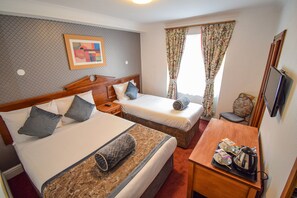 Triple Room | Minibar, blackout curtains, iron/ironing board, free WiFi