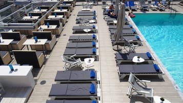 Seasonal outdoor pool, open 11 AM to 7 PM, pool umbrellas, sun loungers