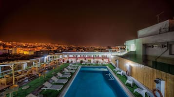 Seasonal outdoor pool, open 11 AM to 7 PM, pool umbrellas, sun loungers