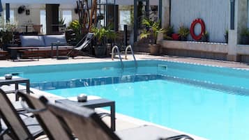 Seasonal outdoor pool, open 11 AM to 7 PM, pool umbrellas, sun loungers
