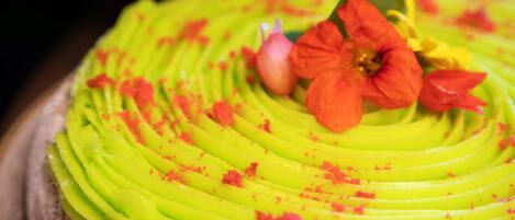 A dessert with green and red toppings.