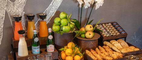 A breakfast buffet with various food items and beverages.