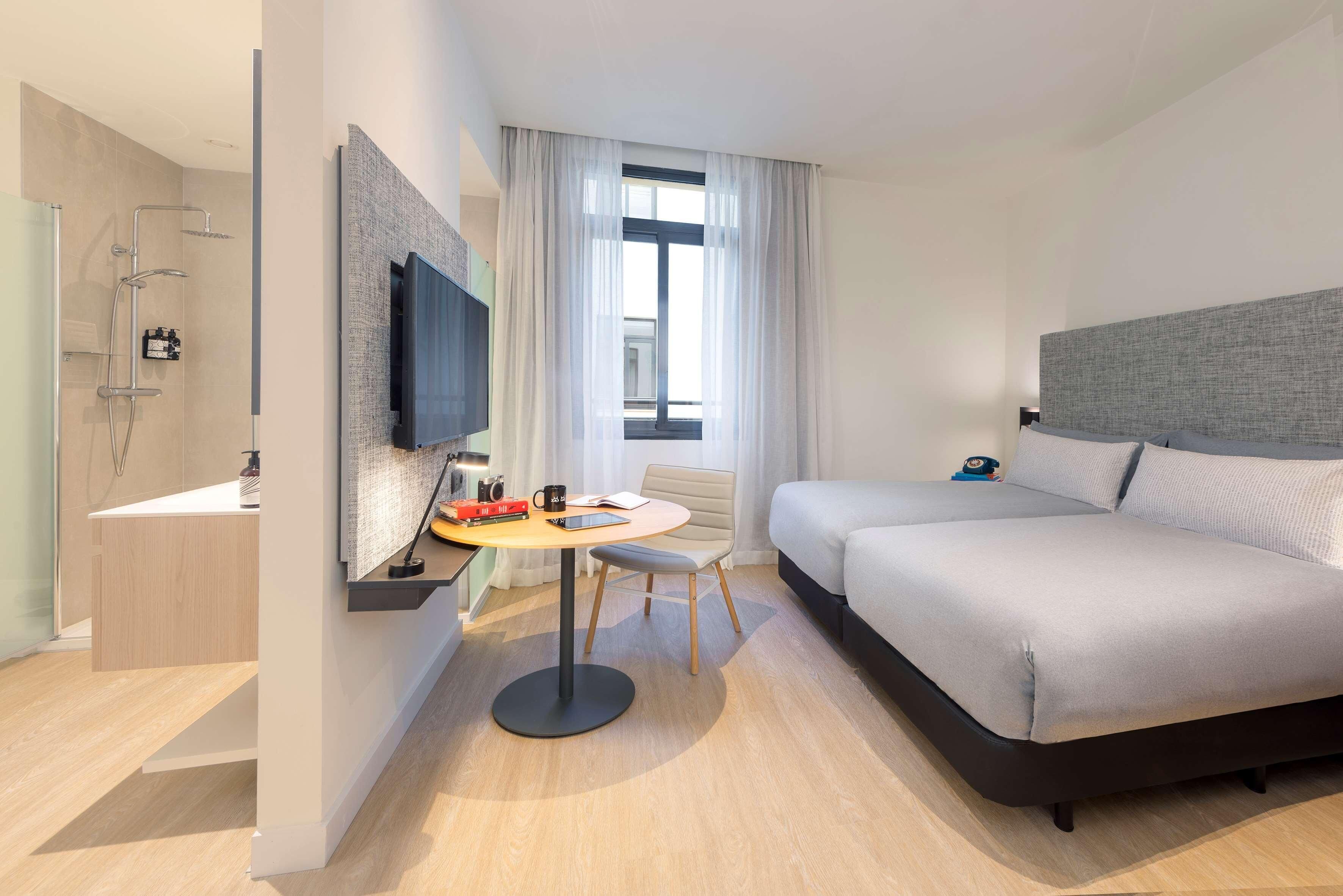 Copriletto in piuma, minibar con snack e bevande gratuite