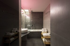 Deluxe Suite, Jetted Tub | Bathroom | Free toiletries, hair dryer, bathrobes, towels