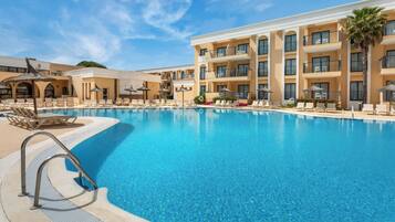 Outdoor pool, pool umbrellas, sun loungers