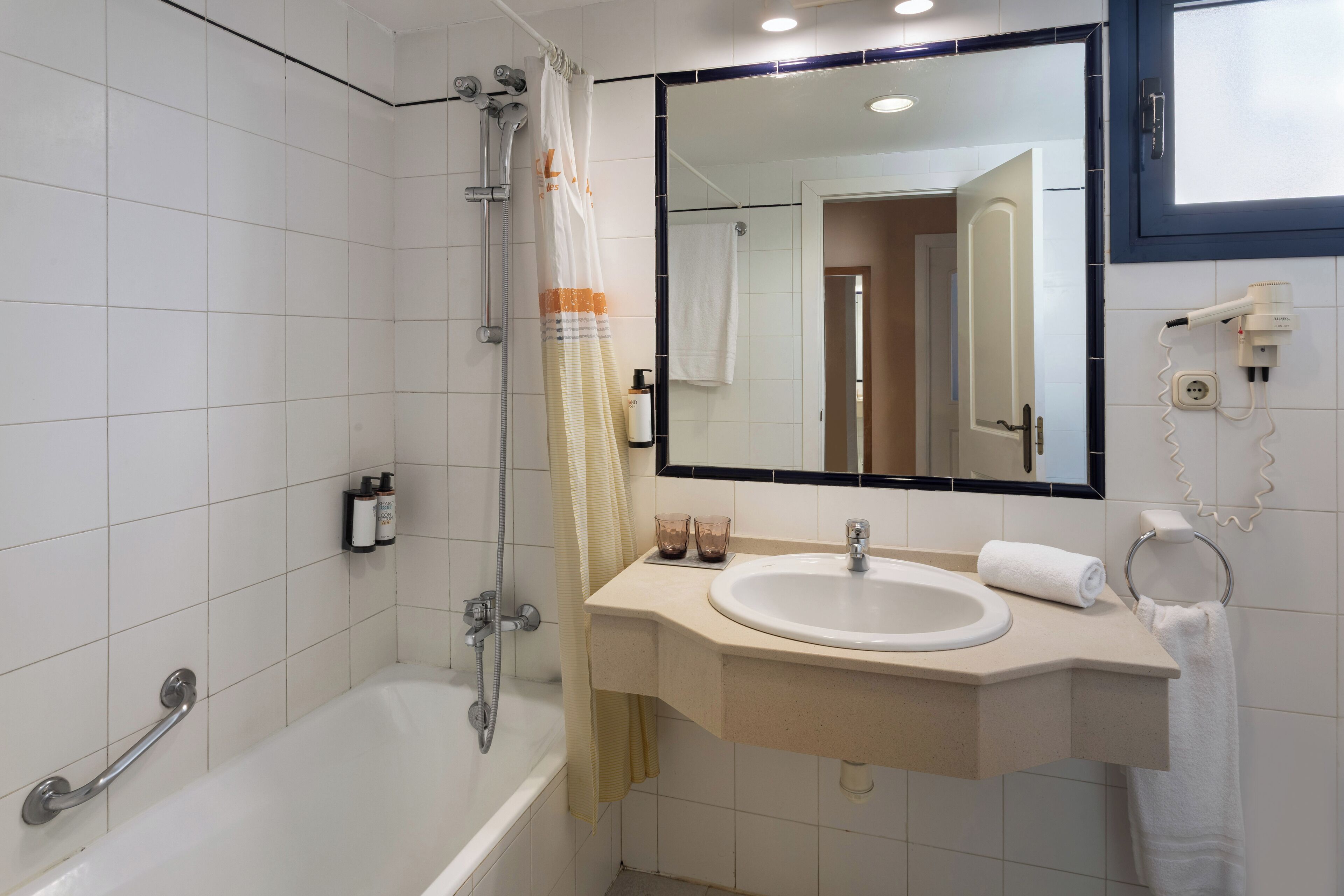 hair dryer, towels, soap, shampoo