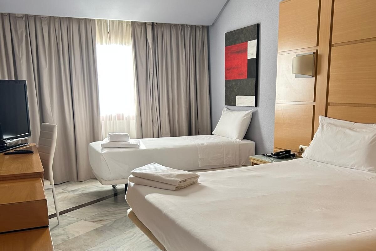 Standard Triple Room | Down comforters, minibar, in-room safe, desk