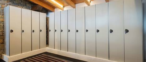 A row of lockers with a bench in the center.