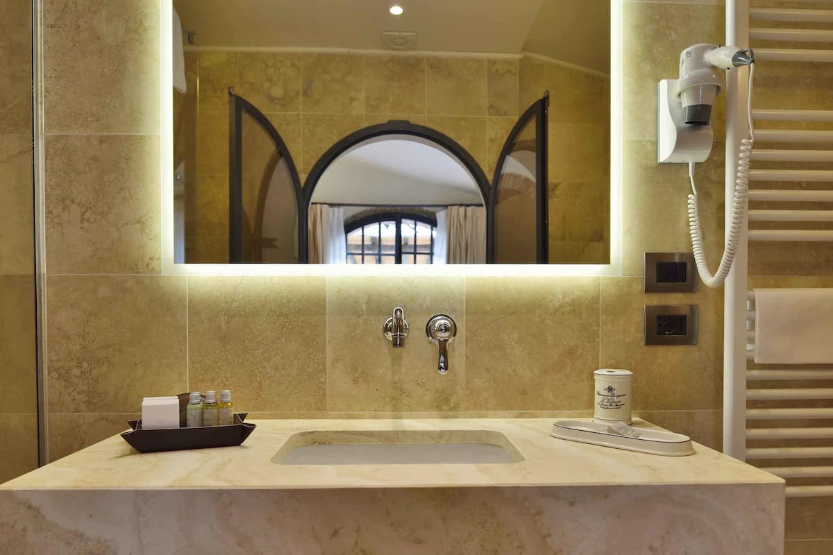 deluxe room, terrace | bathroom | bathtub, rainfall showerhead, hair dryer, slippers