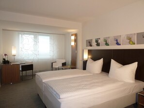 Premium bedding, pillow-top beds, in-room safe, individually decorated