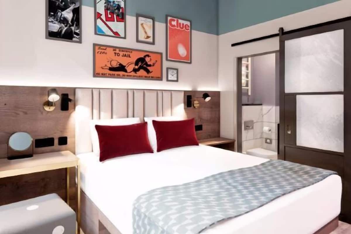 Premium bedding, desk, laptop workspace, iron/ironing board