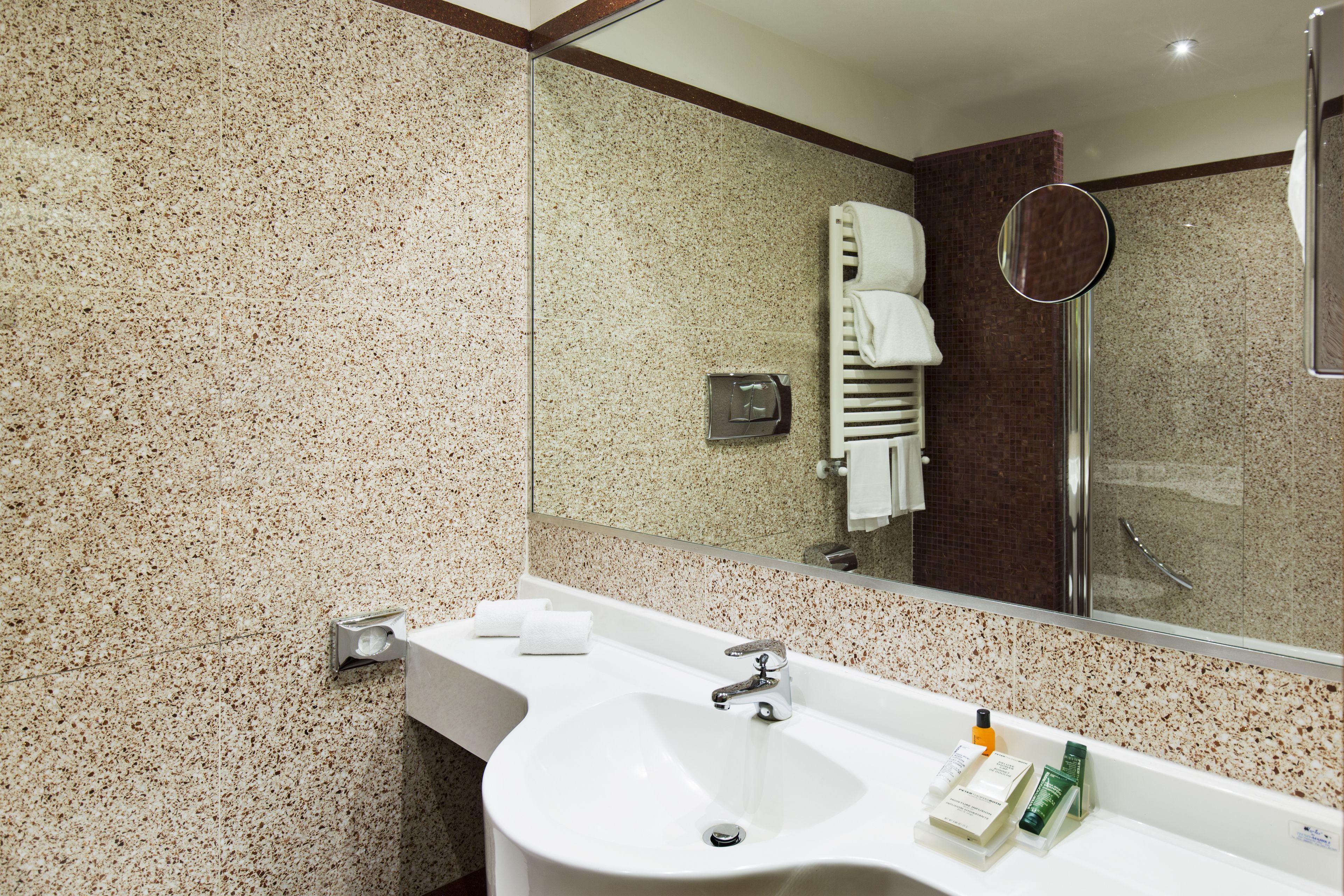 designer toiletries, hair dryer, bidet, towels