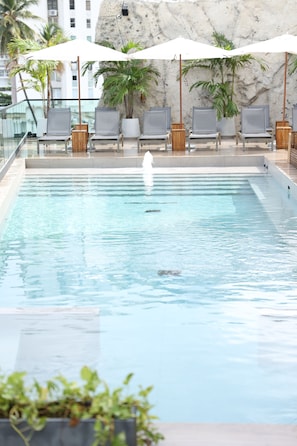 Outdoor pool, pool umbrellas, sun loungers