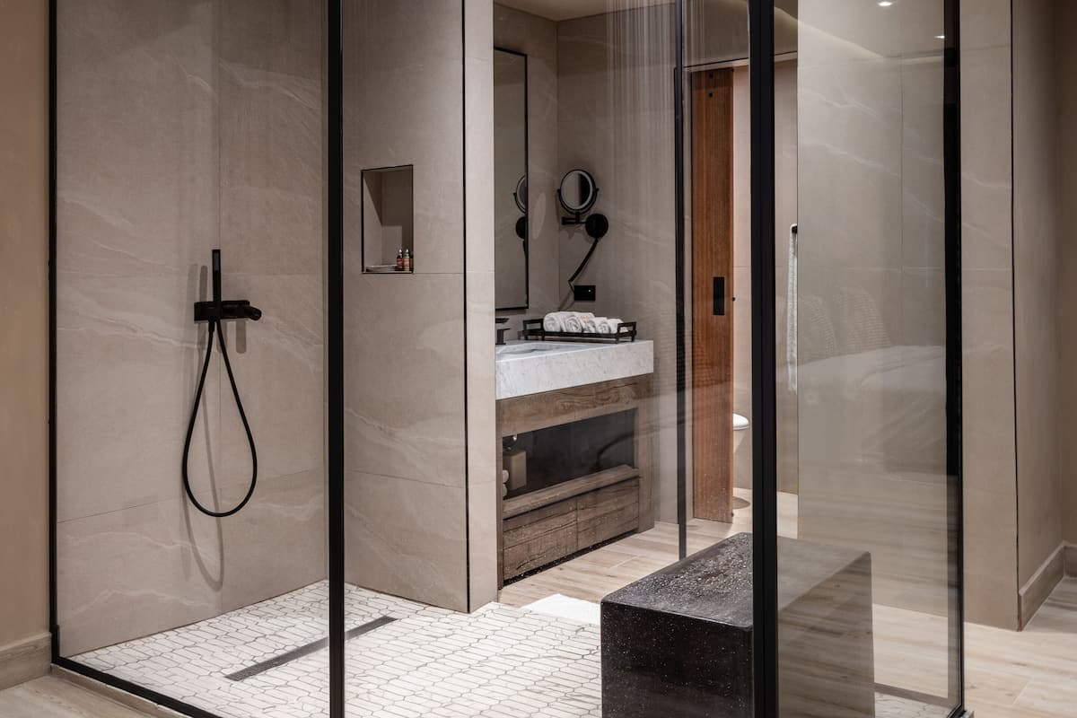 habitat de o:live | bathroom | shower, rainfall showerhead, designer toiletries, hair dryer