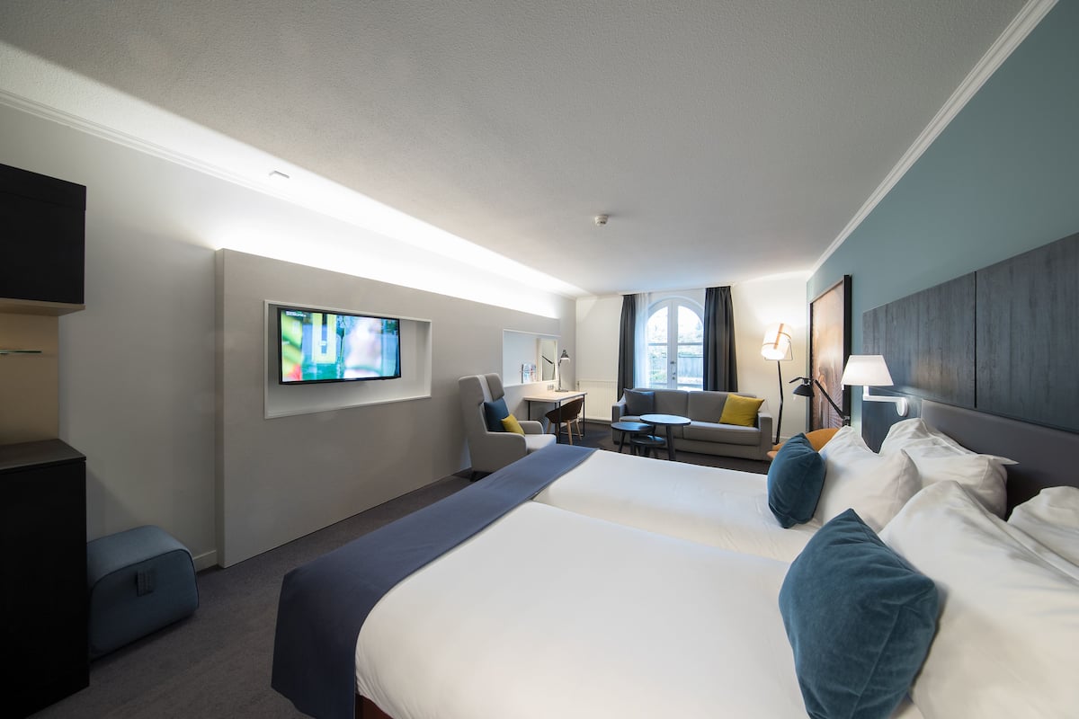 junior suite | in-room safe, desk, blackout curtains, soundproofing