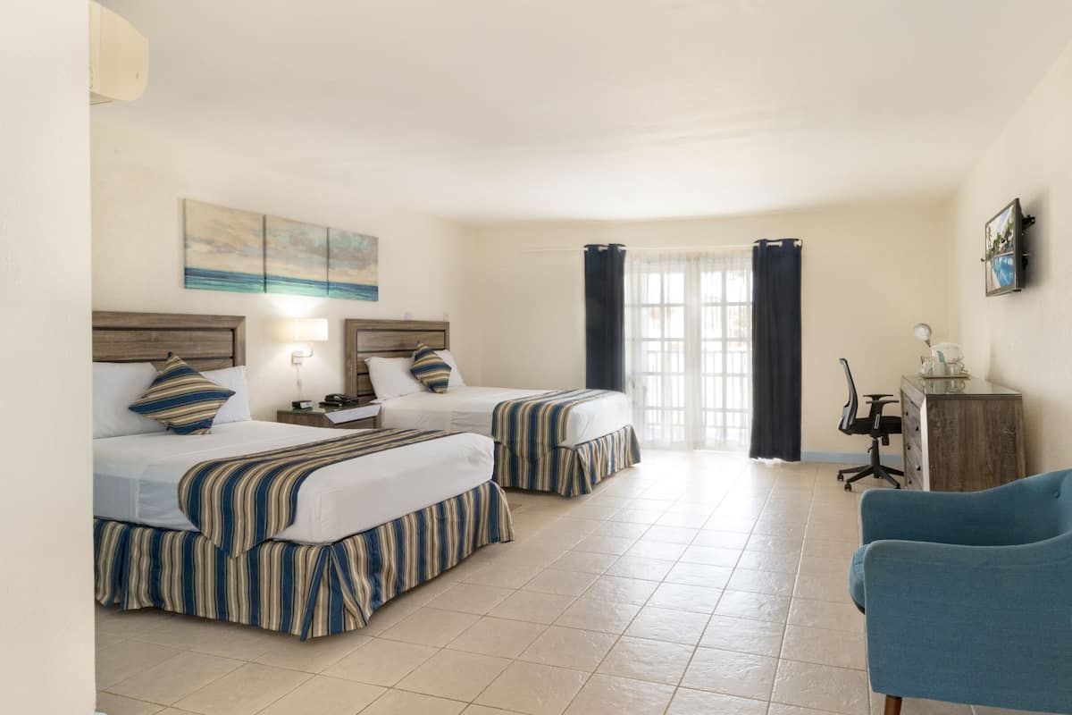 Deluxe Room, 2 Double Beds | In-room safe, desk, iron/ironing board, cribs/infant beds
