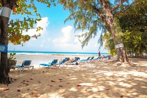 On the beach, sun loungers, beach umbrellas, beach towels