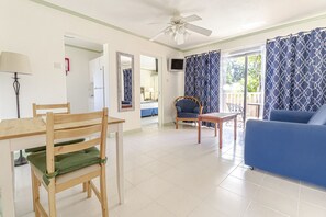 Deluxe Room, 2 Single Beds, Partial View | In-room dining