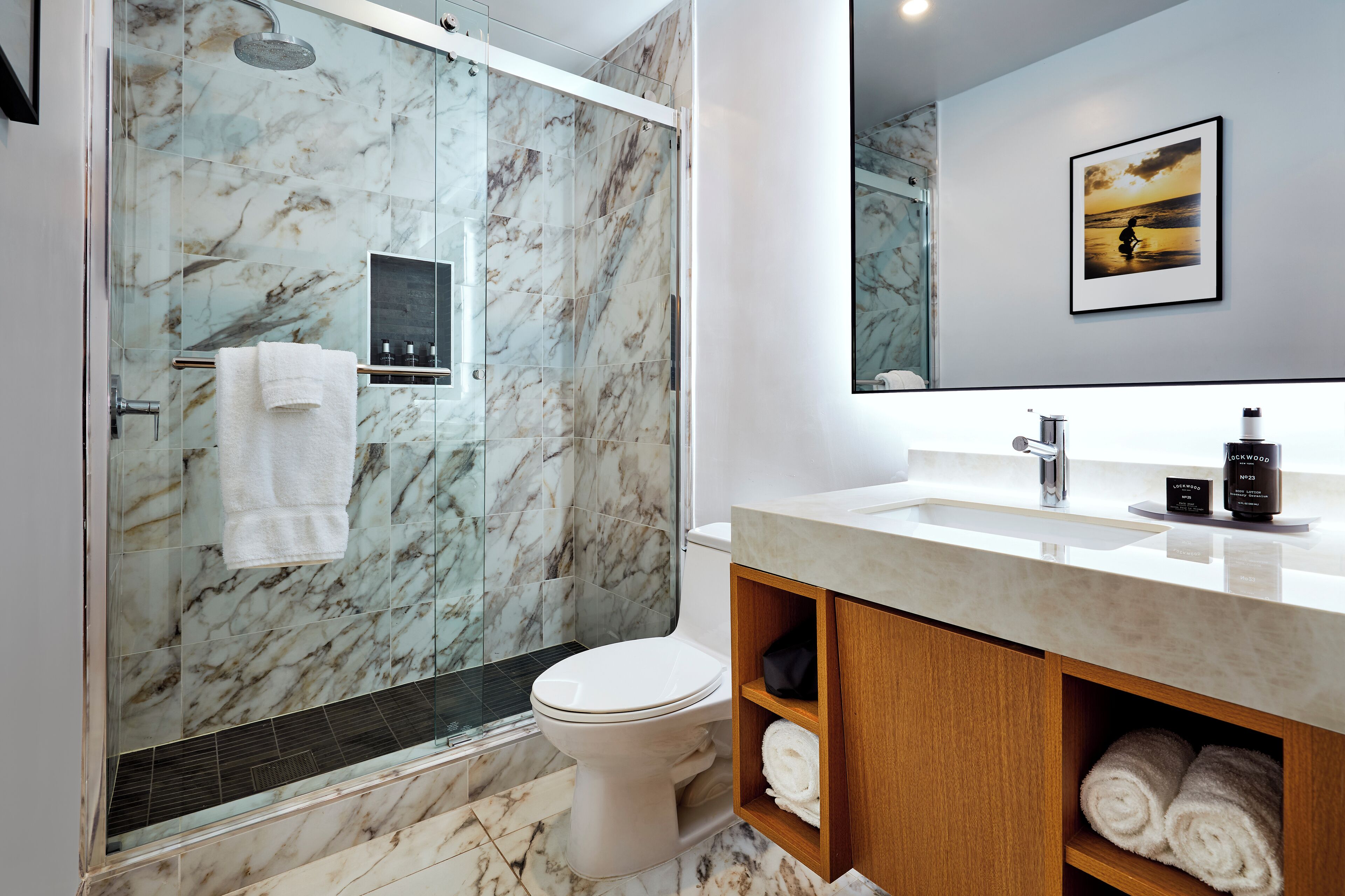 combined shower/bathtub, designer toiletries, hair dryer, bathrobes