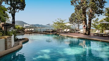 2 outdoor pools, open 8:00 AM to 7:00 PM, pool umbrellas, pool loungers