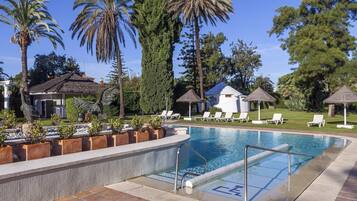 Indoor pool, outdoor pool, open noon to 8:00 PM, pool umbrellas
