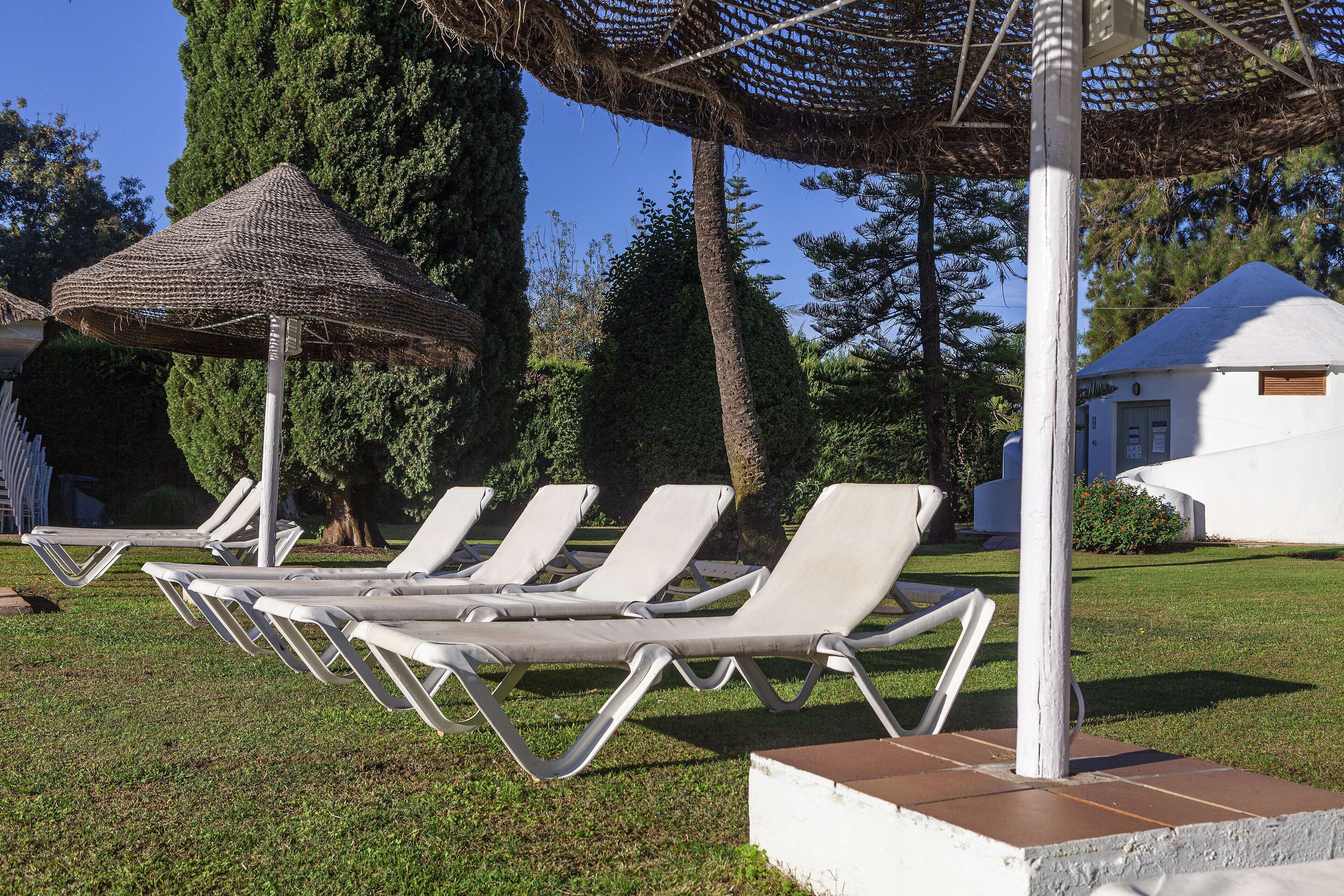 indoor pool, outdoor pool, open noon to 8:00 pm, pool umbrellas