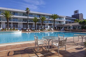 Indoor pool, outdoor pool, open noon to 8:00 PM, pool umbrellas