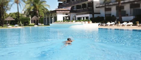 Indoor pool, outdoor pool, pool umbrellas, pool loungers