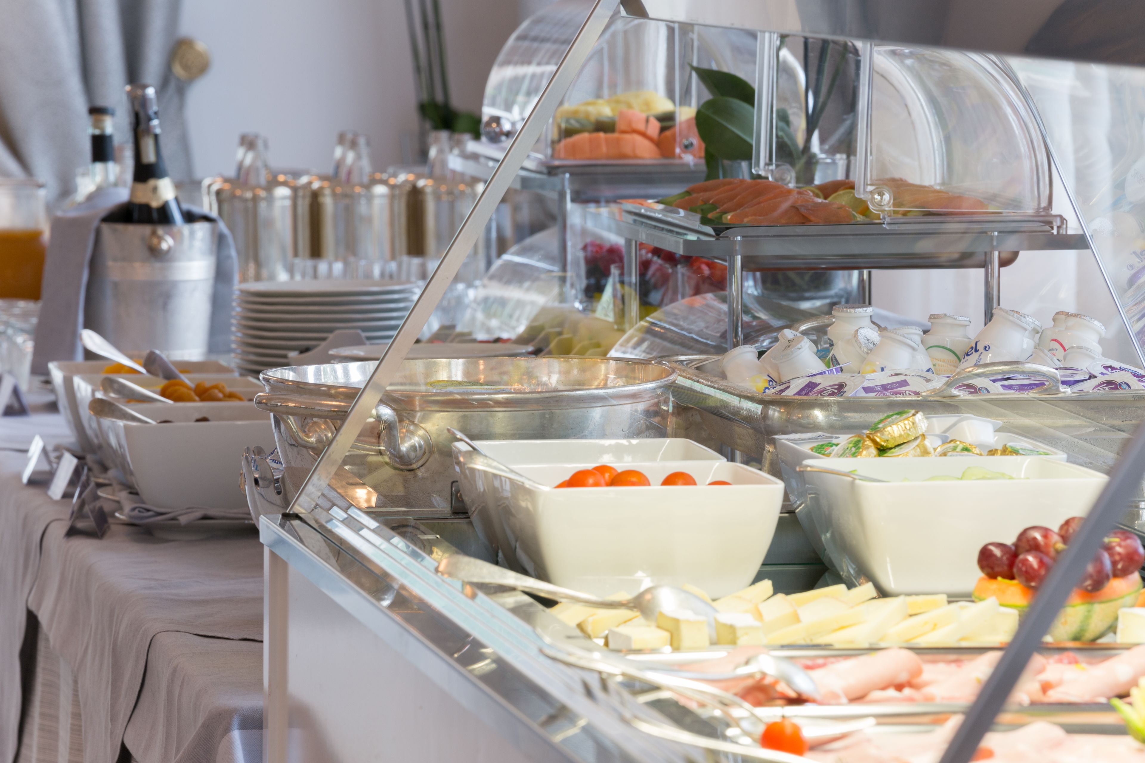 A buffet with various food items and beverages.