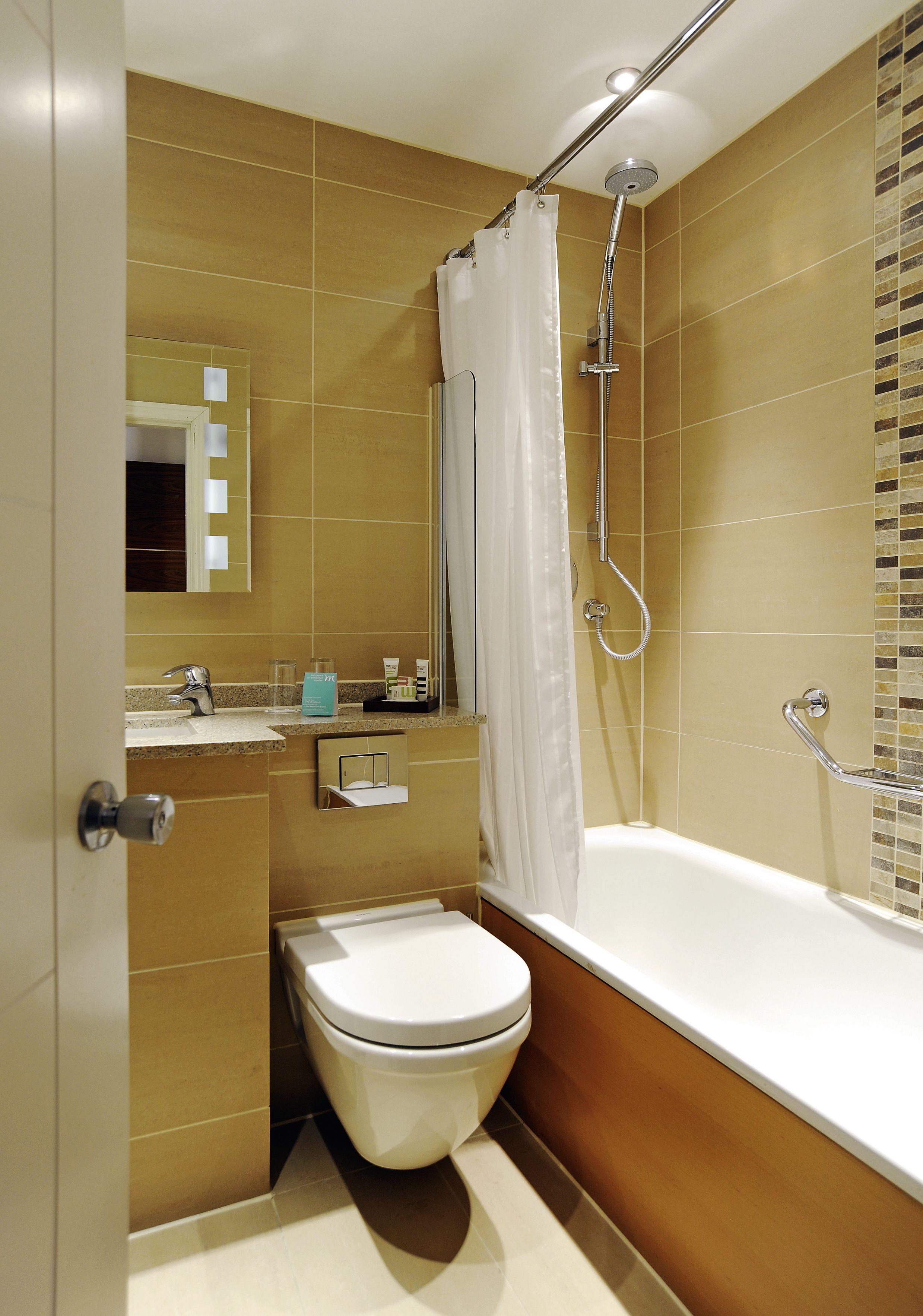 rainfall showerhead, eco-friendly toiletries, hair dryer, towels