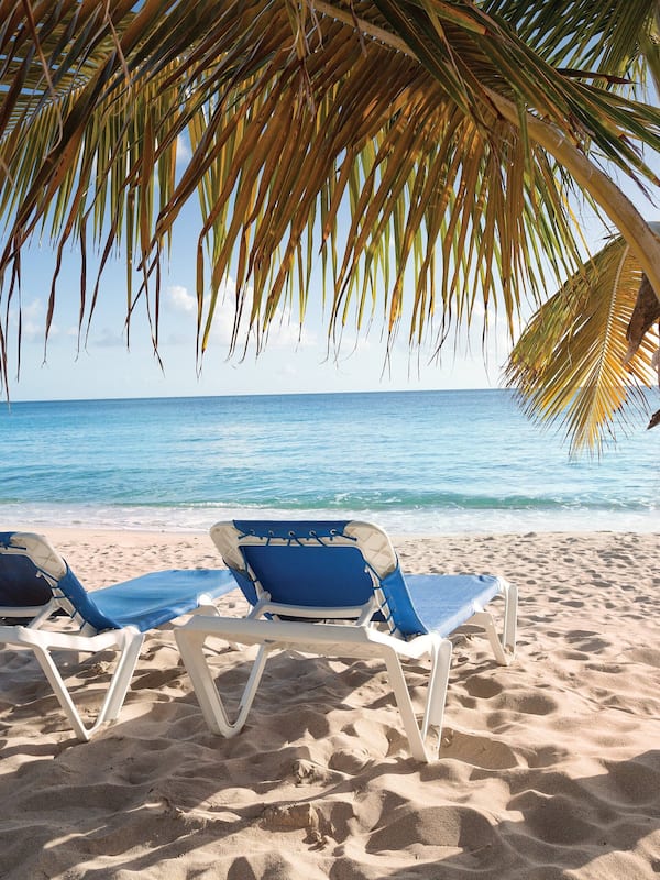 On the beach, sun loungers, beach towels