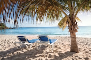 On the beach, sun-loungers, beach towels