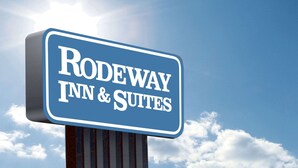 A sign for Rodeway Inn & Suites. - Rodeway Inn & Suites Enterprise (Enterprise)