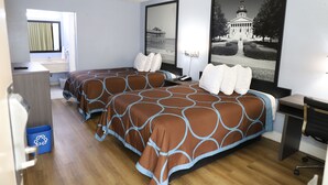 A hotel room with two beds, a desk, a chair, a window with curtains, and a framed picture on the wall. - Super 8 by Wyndham Florence SC I-95 North / Hwy 76 (Florence)