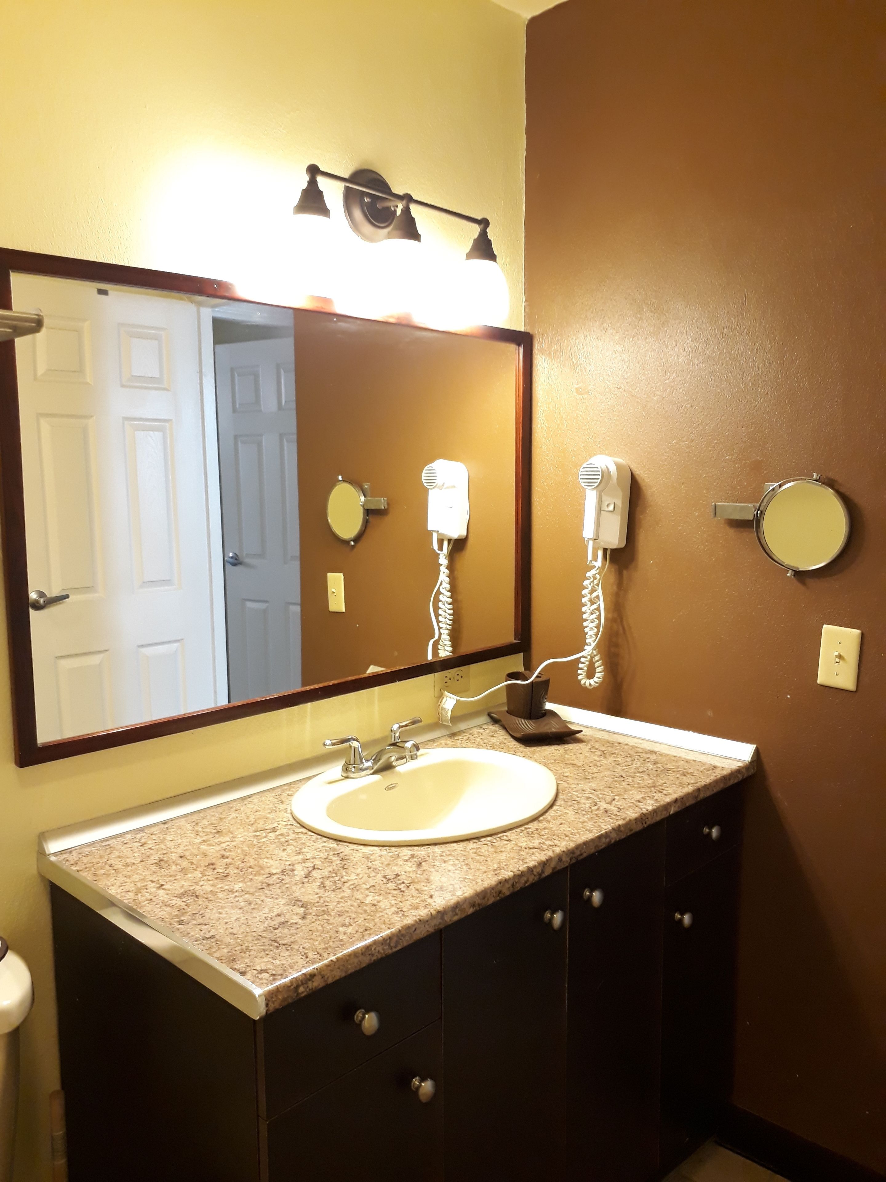 designer toiletries, hair dryer, towels, soap