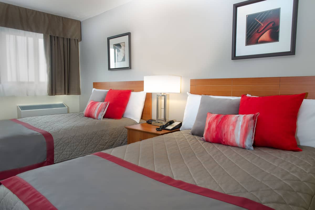 standard double room, 2 double beds | pillow-top beds, desk, laptop workspace, blackout curtains