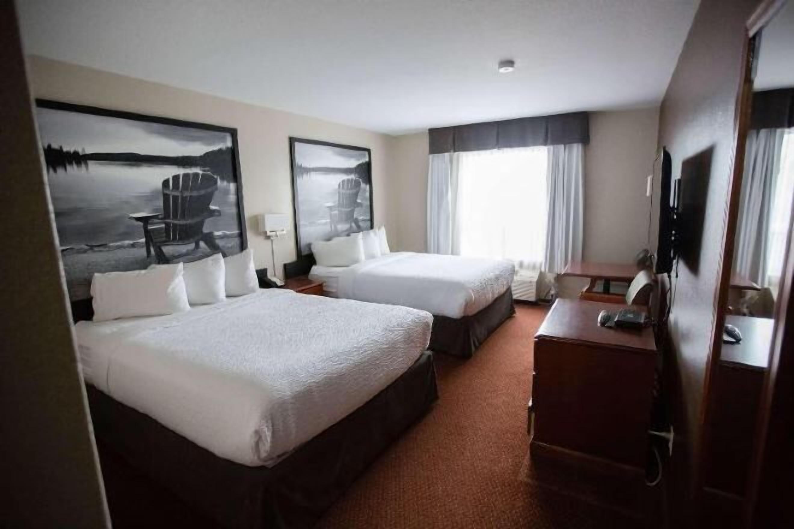 Premium bedding, down comforters, laptop workspace, blackout drapes